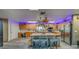 Spacious kitchen with an island, stainless steel appliances, wood cabinetry, and plenty of natural light at 9802 Eden Ave, Hudson, FL 34667