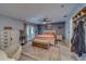 Expansive primary bedroom featuring a cozy seating area, ample closet space, and outdoor access, promoting relaxation at 9802 Eden Ave, Hudson, FL 34667