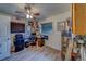 Home office with hardwood floors, natural light, ceiling fan, and organized storage at 9802 Eden Ave, Hudson, FL 34667