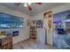 Brightly lit office with a ceiling fan, hardwood floors, and ample space for creativity at 9802 Eden Ave, Hudson, FL 34667