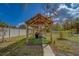 This photo features an outdoor cooking area with a grill and sink under a shelter at 9802 Eden Ave, Hudson, FL 34667