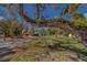 A lush yard features a large mossy tree, a swing, and a view of the house at 9802 Eden Ave, Hudson, FL 34667