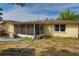 Large backyard featuring screened in patio, ample space for outdoor activities and lounging at 9836 Rainbow Ln, Port Richey, FL 34668