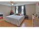 Spacious bedroom with ample closet space, a ceiling fan, and neutral paint at 9836 Rainbow Ln, Port Richey, FL 34668