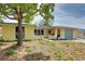 Charming single-story home featuring a well-lit exterior and a neatly maintained front yard at 9836 Rainbow Ln, Port Richey, FL 34668