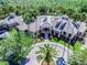 Aerial view of a community center with swimming pool and palm trees at 10144 Arbor Run Dr # 157, Tampa, FL 33647