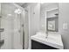 Bathroom features glass-enclosed shower, modern vanity, and ample lighting at 10144 Arbor Run Dr # 157, Tampa, FL 33647