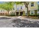 Charming two-story townhome featuring manicured landscaping and classic architectural details at 10144 Arbor Run Dr # 157, Tampa, FL 33647