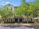 Charming townhome with lush trees, manicured landscaping, and inviting curb appeal at 10144 Arbor Run Dr # 157, Tampa, FL 33647