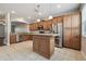 Modern kitchen with stainless steel appliances, center island, and ample cabinet space at 10144 Arbor Run Dr # 157, Tampa, FL 33647