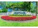 A beautiful Arbor Greene welcome sign, surrounded by colorful flowers at 10144 Arbor Run Dr # 157, Tampa, FL 33647