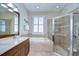 Bathroom showcasing a shower, tub and double sinks, offering relaxation and functionality at 10868 Breaking Rocks Dr, Tampa, FL 33647