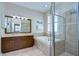 Bathroom showcasing a tub and glass enclosed shower, offering a spa-like retreat at 10868 Breaking Rocks Dr, Tampa, FL 33647