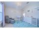 Cozy Bedroom with a glider, soft rug and storage, creating a comforting space at 10868 Breaking Rocks Dr, Tampa, FL 33647