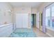 Comfortable bedroom with closet, white dresser, and hardwood floors at 10868 Breaking Rocks Dr, Tampa, FL 33647
