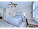 Serene bedroom features a comfortable bed, soft lighting, and a view of the ensuite bathroom at 10868 Breaking Rocks Dr, Tampa, FL 33647