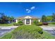 Community clubhouse surrounded by well-manicured landscaping, offering a welcoming space for residents at 10868 Breaking Rocks Dr, Tampa, FL 33647