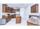 Well-equipped kitchen features granite countertops, stainless steel appliances, and ample cabinet space at 10868 Breaking Rocks Dr, Tampa, FL 33647