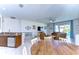 Open living space with kitchen, dining, and living areas featuring stylish decor and natural light at 10868 Breaking Rocks Dr, Tampa, FL 33647