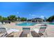 Relaxing community pool with lounge chairs, umbrellas, and a nearby clubhouse for residents' enjoyment at 10868 Breaking Rocks Dr, Tampa, FL 33647