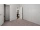 This bedroom offers neutral carpet and paint, walk-in closet, and natural light at 11309 Tulane St, New Port Richey, FL 34654