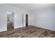 This bedroom features an en suite bath, closet, and luxury vinyl flooring at 11309 Tulane St, New Port Richey, FL 34654