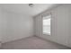 Neutral bedroom with carpet, one window, and light walls ready for your personal touches at 11309 Tulane St, New Port Richey, FL 34654