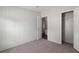 This bedroom offers neutral carpet and paint, walk-in closet, and natural light at 11309 Tulane St, New Port Richey, FL 34654