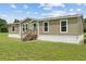 Charming single-story home featuring neutral siding, white trim and a well-maintained lawn at 11309 Tulane St, New Port Richey, FL 34654