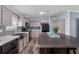 Well-lit kitchen with modern appliances, a functional island, and stylish neutral cabinetry at 11309 Tulane St, New Port Richey, FL 34654