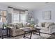 Bright living room with comfortable seating, stylish decor, and plenty of natural light at 11309 Tulane St, New Port Richey, FL 34654