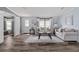 This spacious living room is bright and open with light gray paint, modern flooring, and updated furniture at 11309 Tulane St, New Port Richey, FL 34654