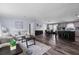 Open-concept living space with wood floors, comfortable seating, and a stylish kitchen island at 11309 Tulane St, New Port Richey, FL 34654