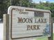 Pasco County's Moon Lake Park sign in a sunny location near the park grounds at 11309 Tulane St, New Port Richey, FL 34654
