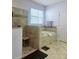 Bathroom featuring a soaking tub, walk-in shower, and tile floors at 11936 Sand Myrtle Rd, Riverview, FL 33579