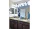 Double sink bathroom vanity with granite countertop, offering a functional and stylish space at 11936 Sand Myrtle Rd, Riverview, FL 33579
