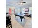 Bright bonus room featuring tile floors, neutral walls, and large windows offering plenty of natural light at 11936 Sand Myrtle Rd, Riverview, FL 33579