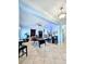 Spacious bonus room with tile flooring and ample lighting; perfect for entertaining or relaxing at 11936 Sand Myrtle Rd, Riverview, FL 33579