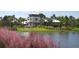 Community center overlooking a serene lake, surrounded by lush greenery, offering a picturesque view at 11936 Sand Myrtle Rd, Riverview, FL 33579