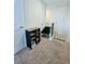 Upstairs hall with carpet, a chair, and door leading to another room at 11936 Sand Myrtle Rd, Riverview, FL 33579