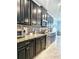 Kitchen featuring dark cabinets, granite countertops, and stainless steel appliances at 11936 Sand Myrtle Rd, Riverview, FL 33579