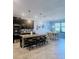Modern kitchen featuring a center island with seating and a dining area, ideal for Gathering meals at 11936 Sand Myrtle Rd, Riverview, FL 33579