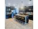 Well-equipped kitchen featuring a center island with seating, stainless appliances and ample counter space at 11936 Sand Myrtle Rd, Riverview, FL 33579