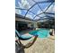 View of a beautiful pool with screened in patio and outdoor furniture at 11936 Sand Myrtle Rd, Riverview, FL 33579