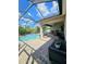 View of a screened in patio with an outdoor dining set and beautiful pool at 11936 Sand Myrtle Rd, Riverview, FL 33579