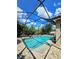 View of a beautiful pool with screened in patio and outdoor furniture at 11936 Sand Myrtle Rd, Riverview, FL 33579