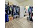 Well-organized walk-in closet with shelves and rods for ample storage at 11936 Sand Myrtle Rd, Riverview, FL 33579