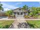 Charming home with a white picket fence, well-manicured lawn, and inviting front porch at 1330 Cherry Ne St, St Petersburg, FL 33701