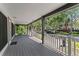 Spacious covered front porch with a grey floor and railing at 1330 Cherry Ne St, St Petersburg, FL 33701