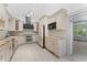 Bright kitchen featuring stone countertops, stainless steel appliances, and ample cabinet space at 1330 Cherry Ne St, St Petersburg, FL 33701